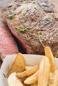 Sirloin steak with potato wedges (close-up)