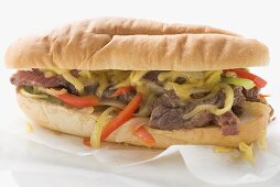 Steak sandwich with peppers and cheese