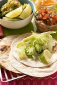 Wrap ingredients, salsa and guacamole (Mexico)