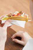 Hands holding minco taco