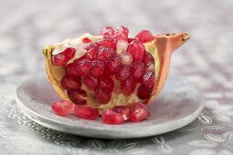 Wedge of pomegranate on plate