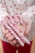Woman holding candy canes