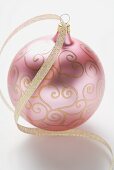 Pink Christmas bauble with gold ribbon