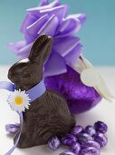 Chocolate Bunny and chocolate Easter eggs in purple foil