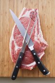 Fresh beef chop with knife and meat fork