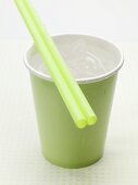 Iced water in cup with straws