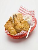 Fried chicken with coleslaw and scone in plastic basket