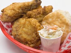 Fried chicken with coleslaw and scone in plastic basket