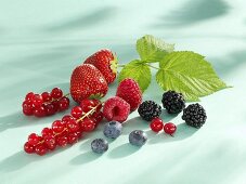 Assorted berries with raspberry leaf