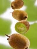 Three whole baby kiwis and half a baby kiwi