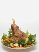 Lamb shank with quails' eggs, carrots and parsley for Easter
