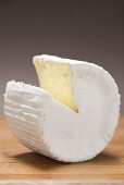 Goat's cheese with a section removed
