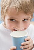 Little boy with milk round his mouth