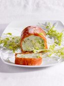 Avocado and salmon roulade with bean sprouts