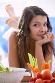 Girl with fresh vegetables