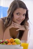 Girl with fresh fruit and orange juice