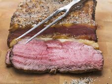 Roast beef with meat fork