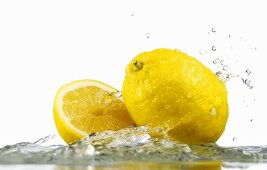 Lemons with splashing water