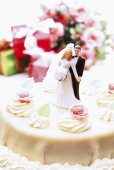 Wedding cake with bride and groom topper