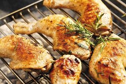 Chicken legs with rosemary on barbecue
