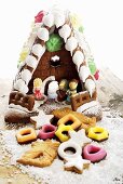 Lebkuchenhaus und Weihnachtsplätzchen