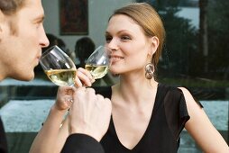 Young couple drinking white wine