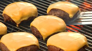 Grilling meat patties for cheeseburgers
