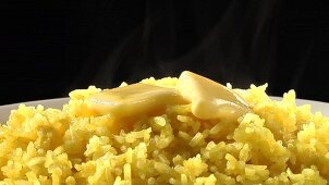 Yellow rice with knobs of butter