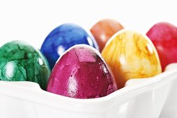 Easter eggs in egg holder (close-up)