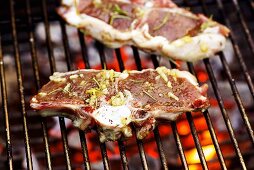 Marinated lamb chops on barbecue rack