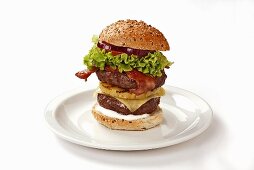 Double-decker burger with bacon and pineapple