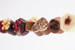 Row of assorted chocolates (close-up)