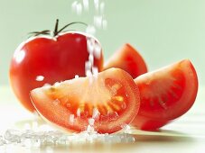 Sprinkling tomatoes with salt