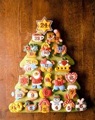 Baked Christmas cake as Advent calendar on wooden box