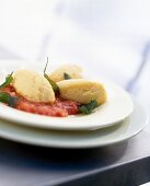 Polenta gnocchi with tomato-sage sauce in plate