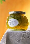 Gooseberry cider jam in glass jar on table