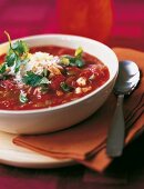 Chicken and vegetable stew with chilli, coriander and rice in white bowl