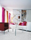 Living room with sofa, curtains and cushions
