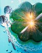 Close-up of lucky charms dessert with shamrock jelly and sparkler on plate