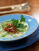 Close-up of green bean soup with bacon on plate