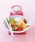 Vegetables and basmati rice in bowl with chopsticks