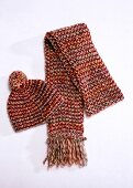 Woolen scarf with matching hat on white background