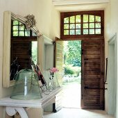 Hallway with pantry, glass bell and door to garden