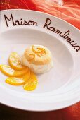 Close-up of lavender parfait ice cream with peach slices on plate