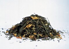 Herb tea leaves on white background
