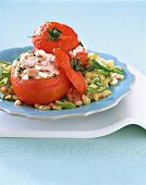 Close-up of tender wheat with stuffed tomatoes on plate