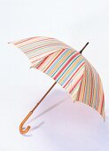 Striped umbrella on white background