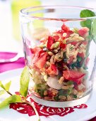 Close-up of tomato and parsley salad in glass