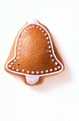 Close-up of gingerbread bell on white background