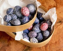 Blue and red fully blew and finely painted eggs on tray